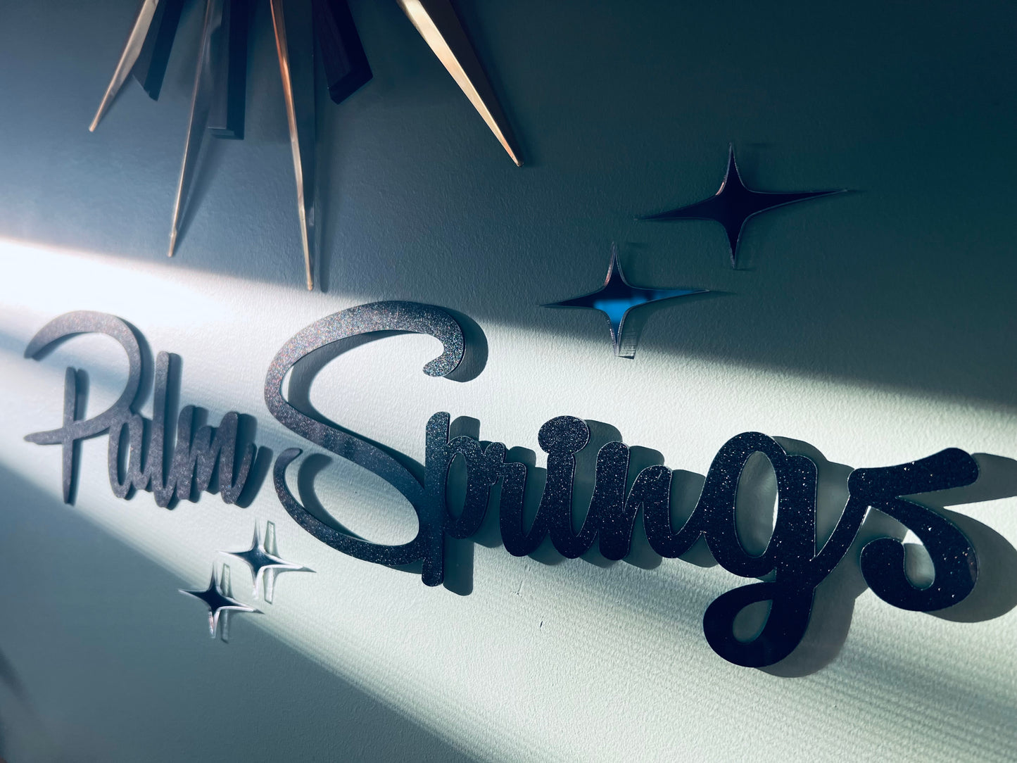 Plain Palm Springs Signage With Elongated Mirrored Diamonds.