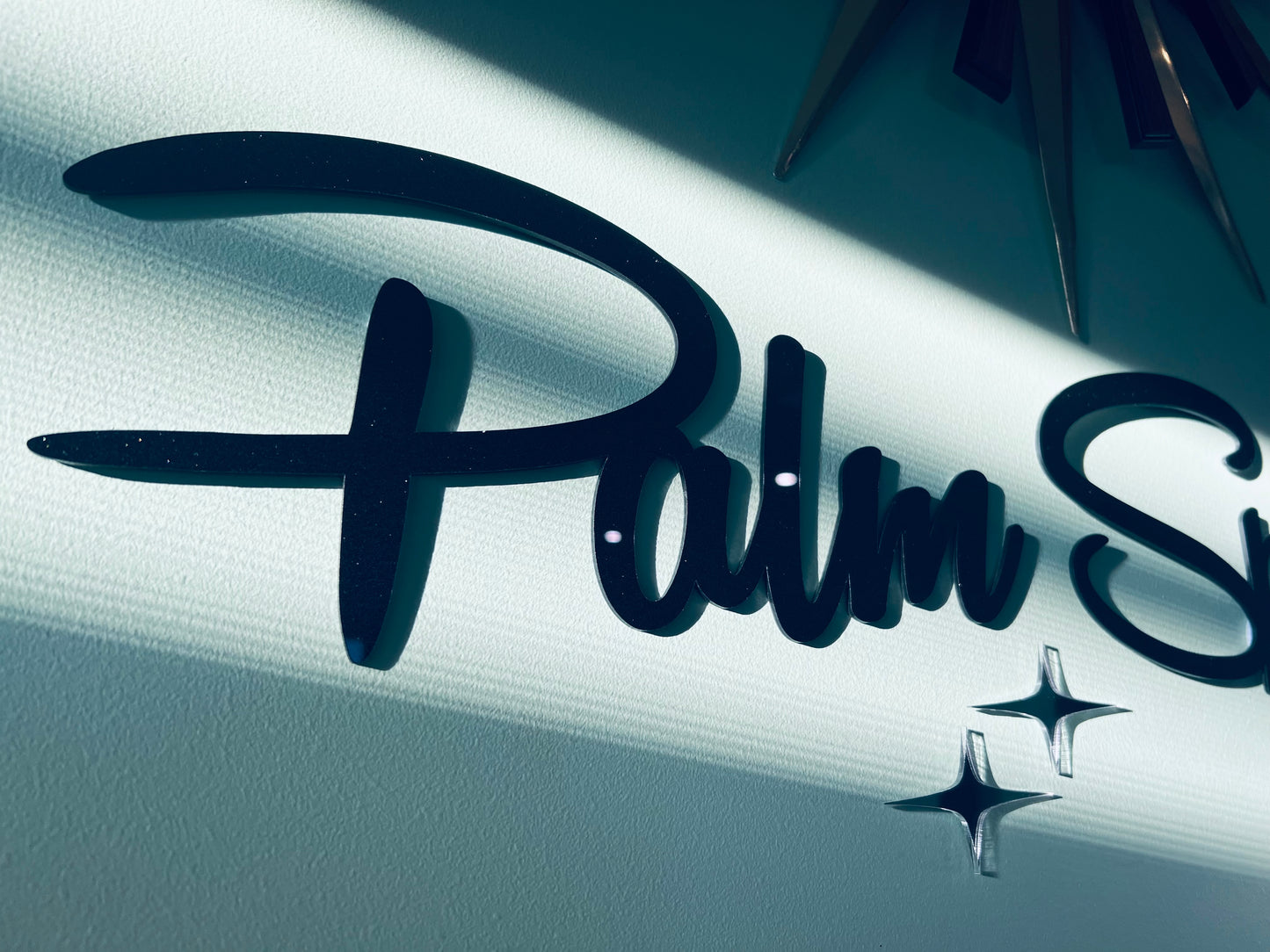 Plain Palm Springs Signage With Elongated Mirrored Diamonds.