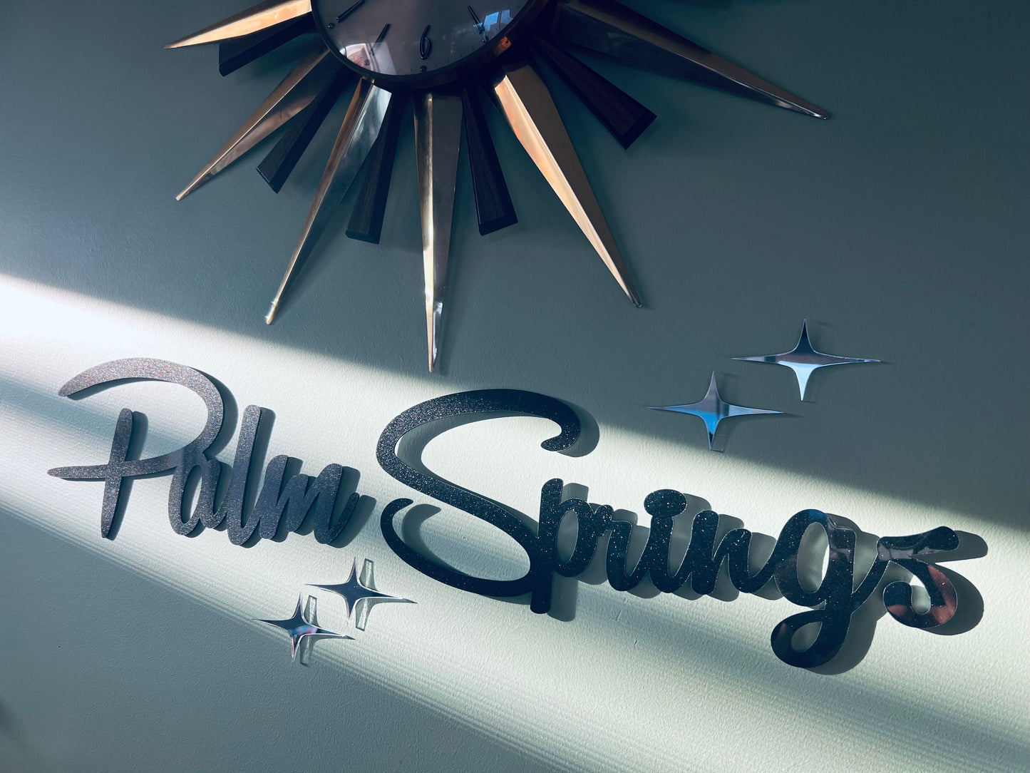Plain Palm Springs Signage With Elongated Mirrored Diamonds.